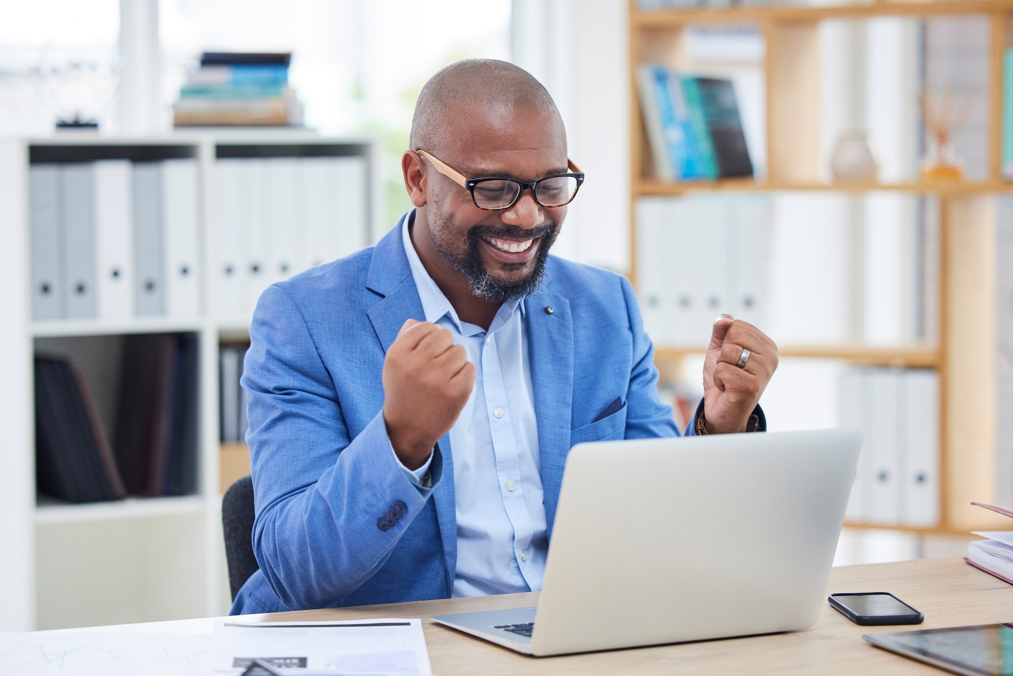 Black man, business and winner with success and yes, professional achievement, laptop and new deal,